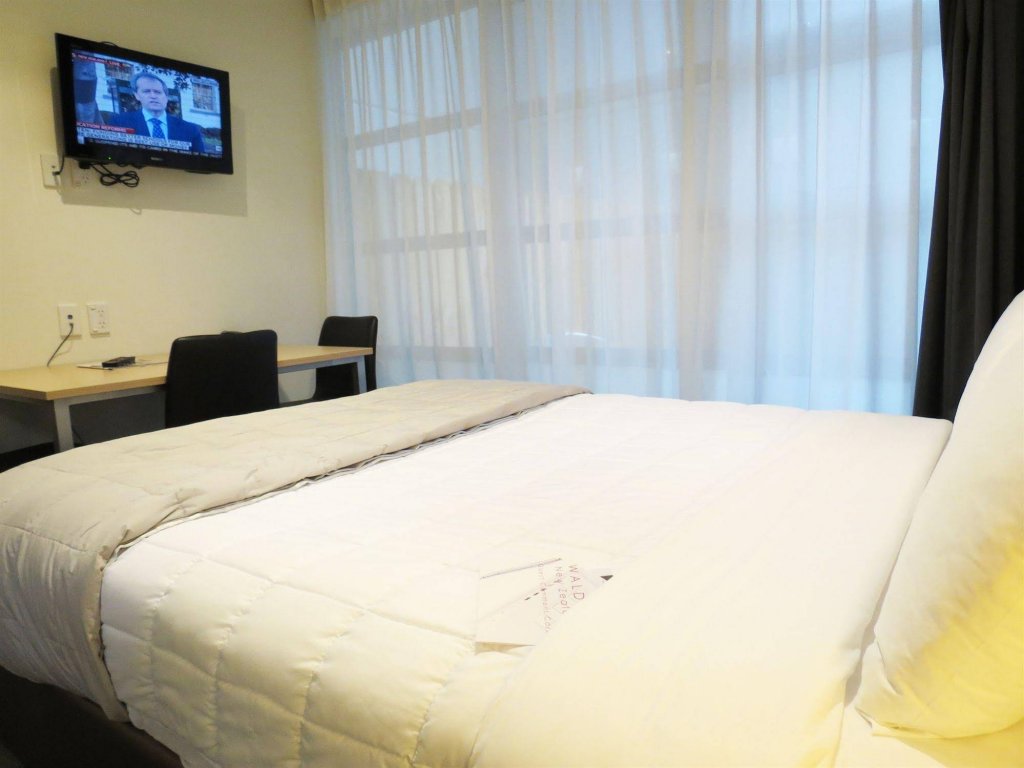 Фото Tetra Serviced Apartments by Castle