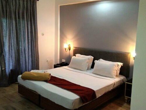 Гостиница Carina Beach Resort в Бенаулиме
