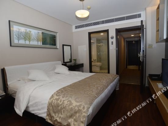 Фото Qingdao Housing International Hotel