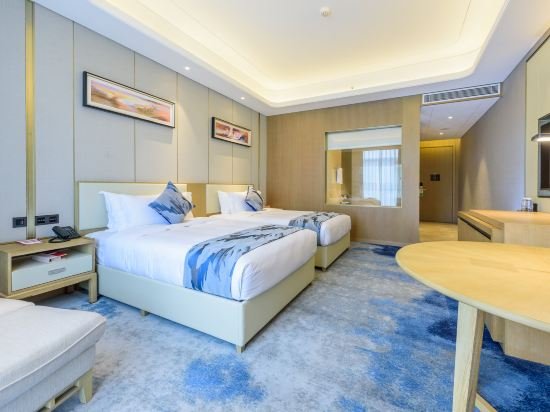 Фото Ramada Plaza Dongxing City Center