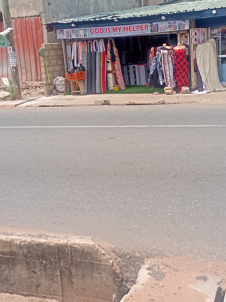 Clothing store God is my helper, Accra, photo