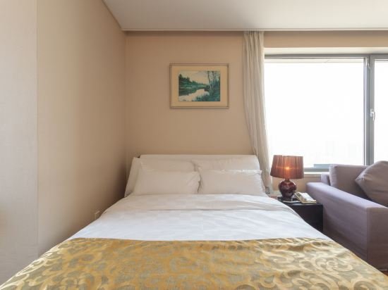 Фото Qingdao Housing International Hotel