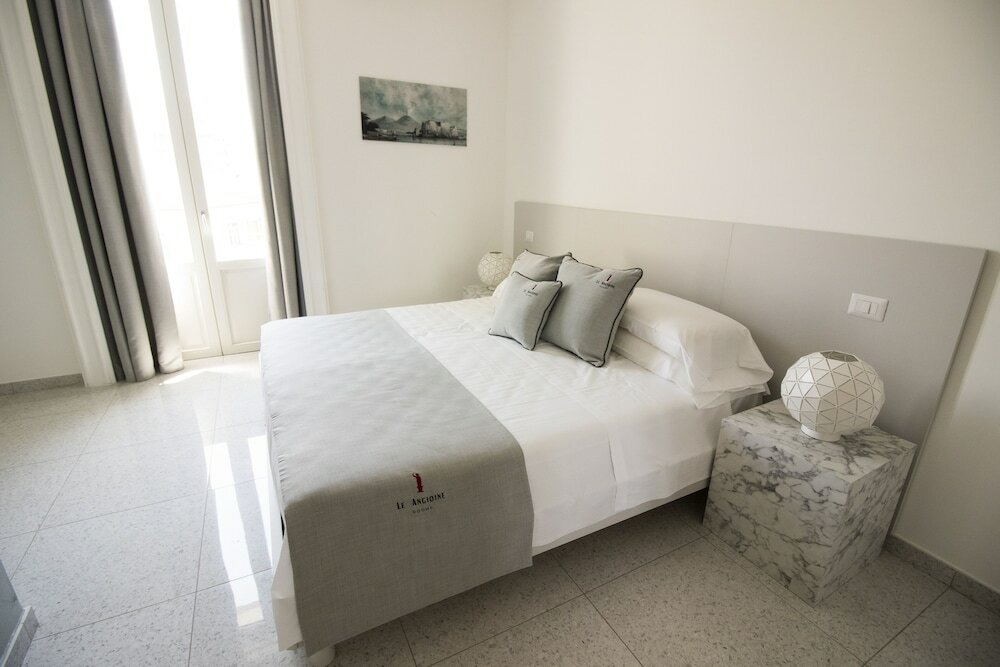 Фото Le Angioine Rooms