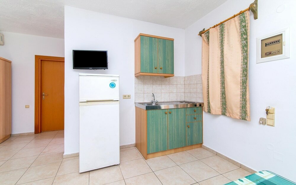 Фото Dionysos Apartments & Studios