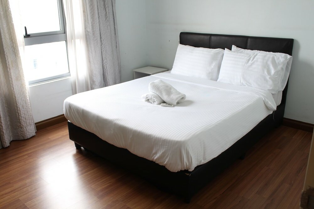 Фото Peaceful Service Suites at Taragon Puteri Bintang