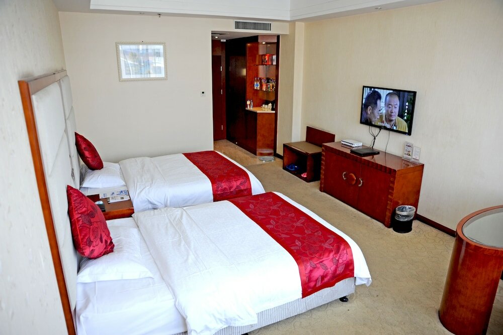 Фото Dinis Business Hotel Kaiyuan Branch