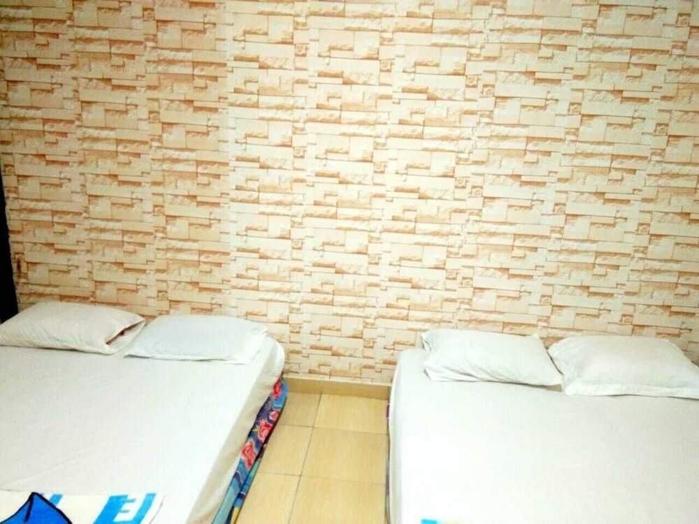 Фото Penginapan Bunar Tunggal