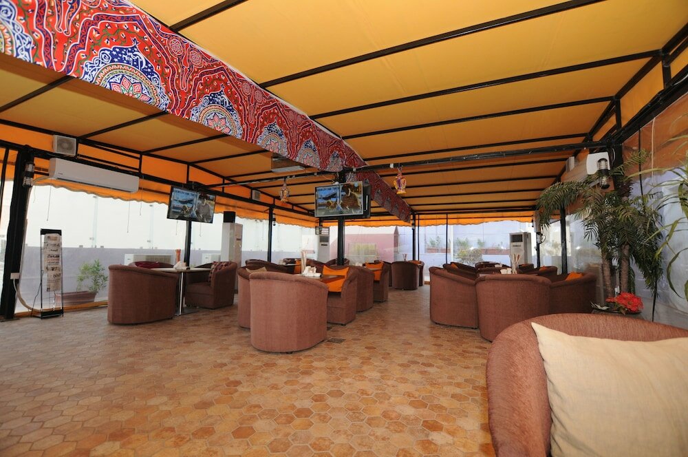 Фото Al Muhanna Plaza Hotel