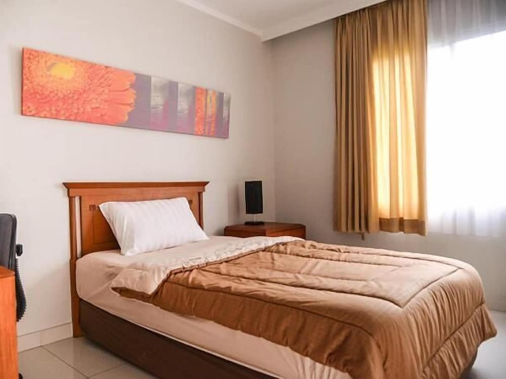 Фото Griya Prapanca Apartment