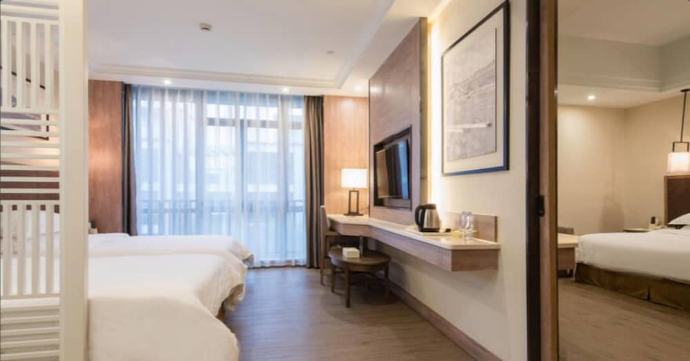 Фото Auden International Hotel