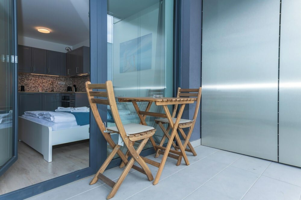 Фото WaterFront City Apartments by UrbanRent