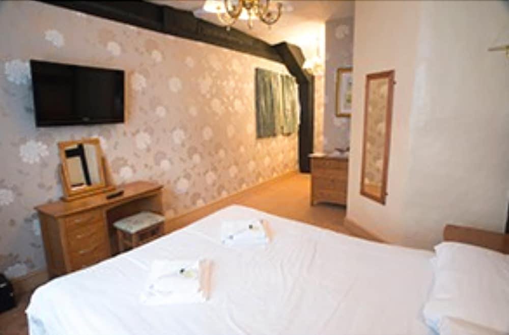 Фото The New Inn by Roomsbooked