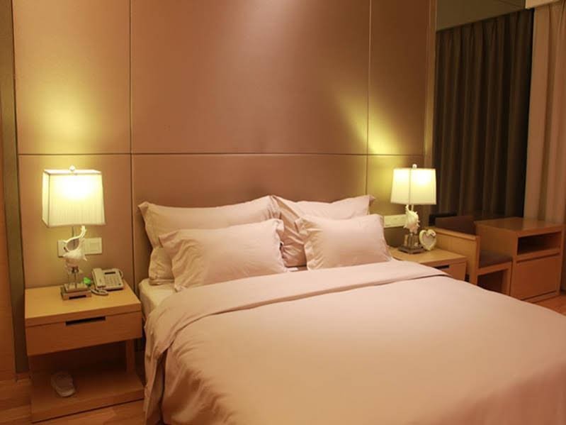 Фото Guangzhou Xing Yi International Apartment - Poly World Branch