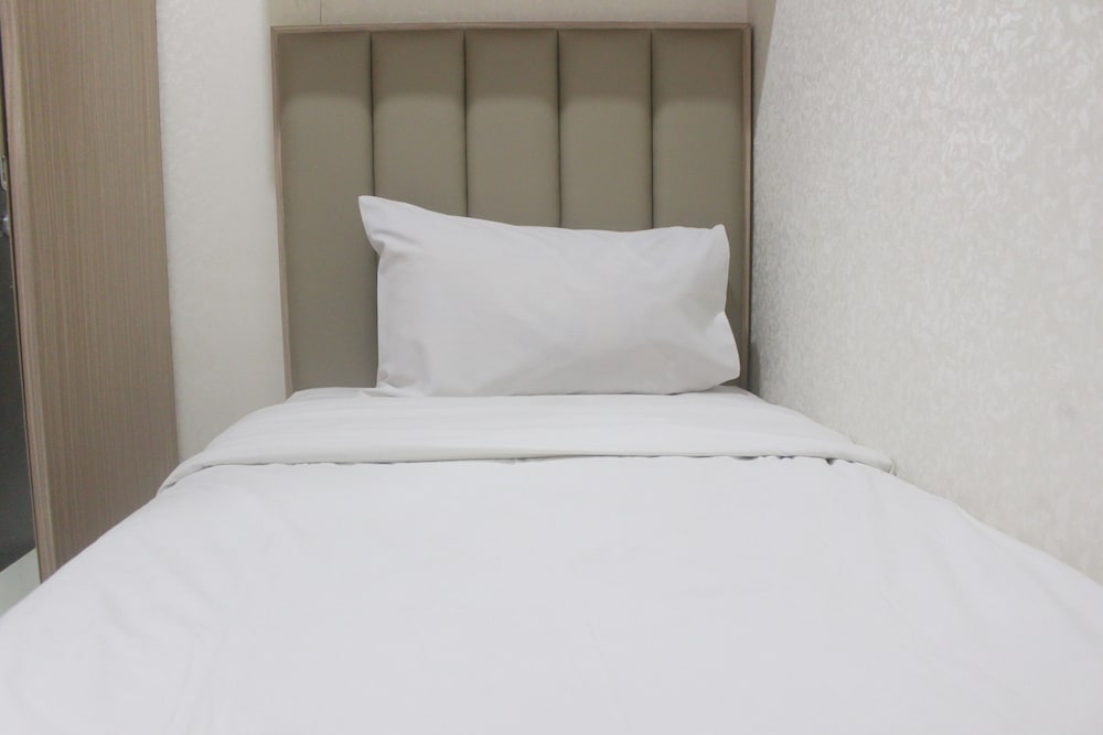 Фото Simple And Homey 2Br Apartment At Grand Asia Afrika