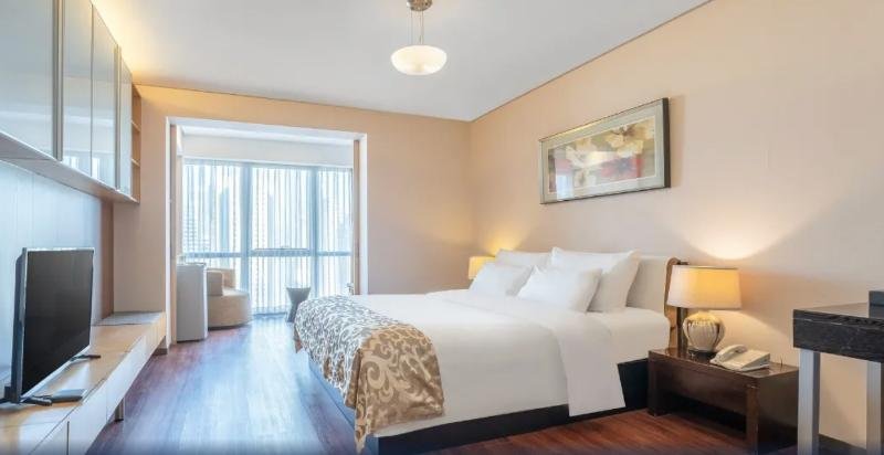 Фото Qingdao Housing International Hotel