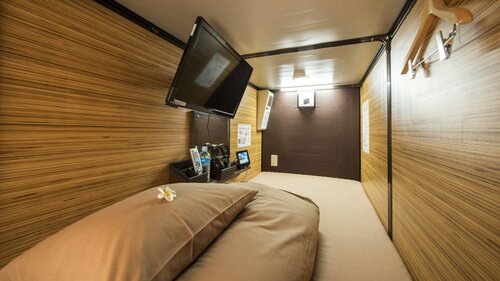 Гостиница Capsule Hotel Anshin Oyado Shinbashi Shiodome в Токио