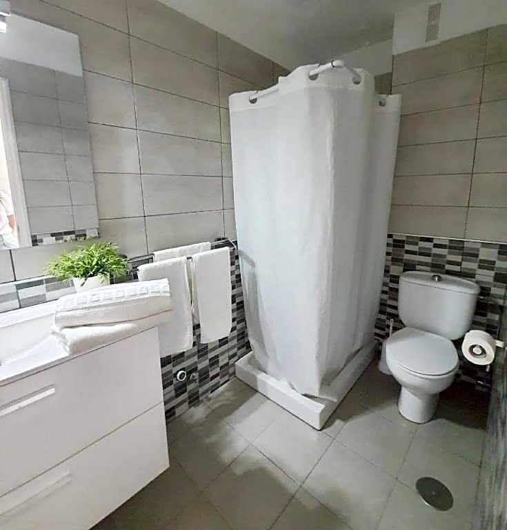 Фото Comodoro Apartments