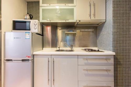 Фото Shanghai Yueyi Apartment Hotel