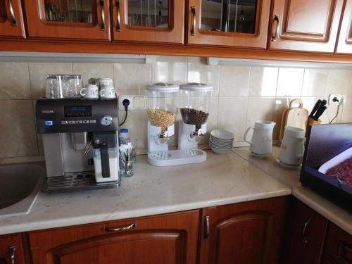 Фото Sunrise Apartmanház