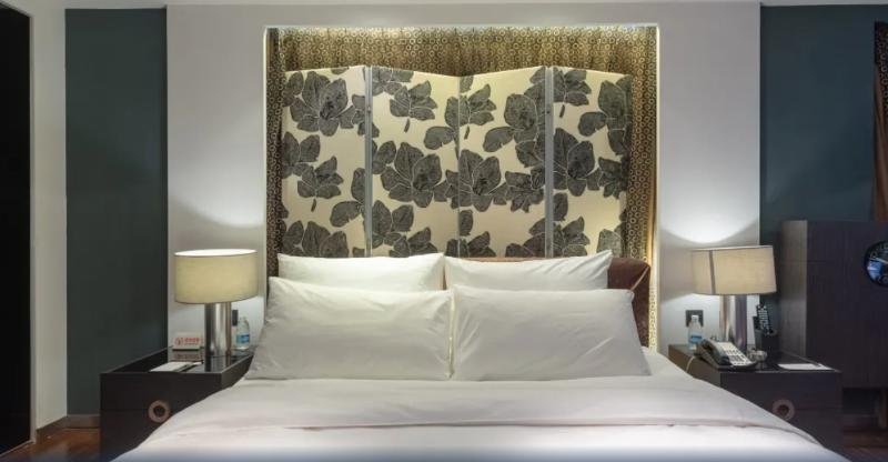 Фото Qingdao Housing International Hotel