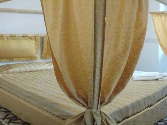 Фото Merulana Suite Apartment