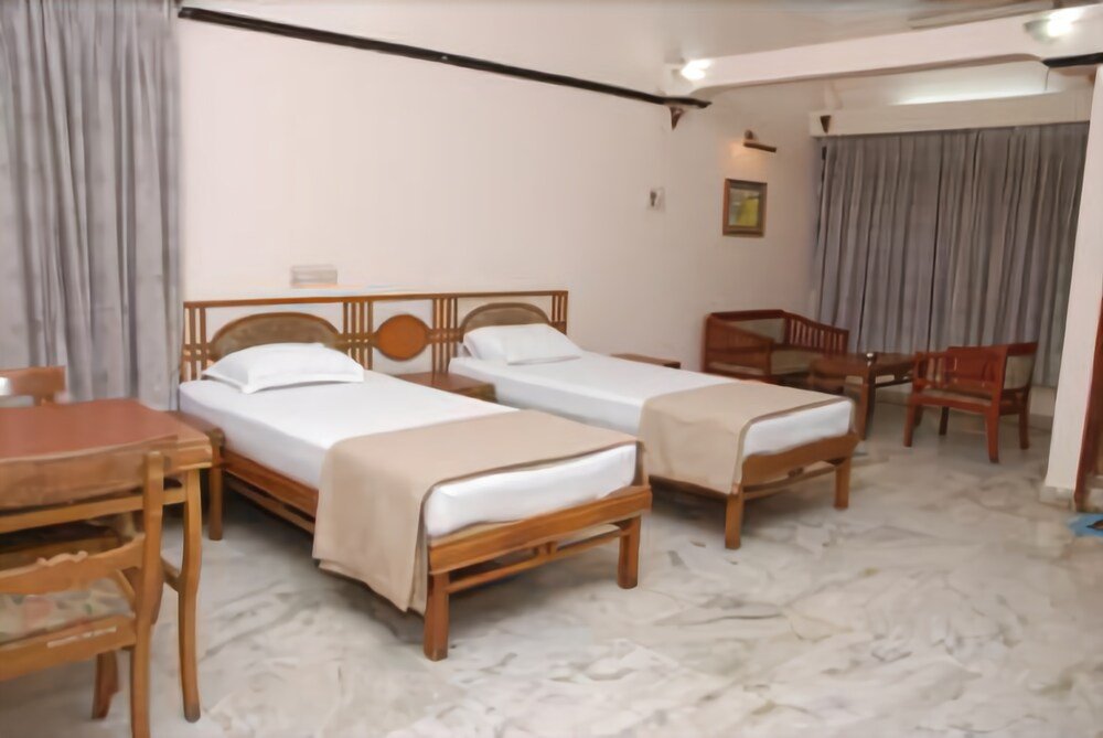 Фото Amogha International Hotel