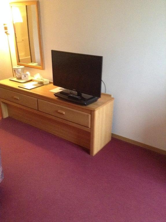 Фото Designer Inn & Suites