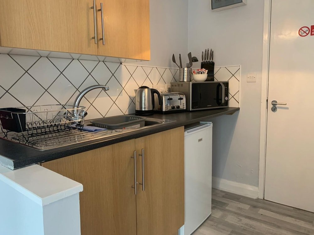 Фото Grey Stone Studio Apartments