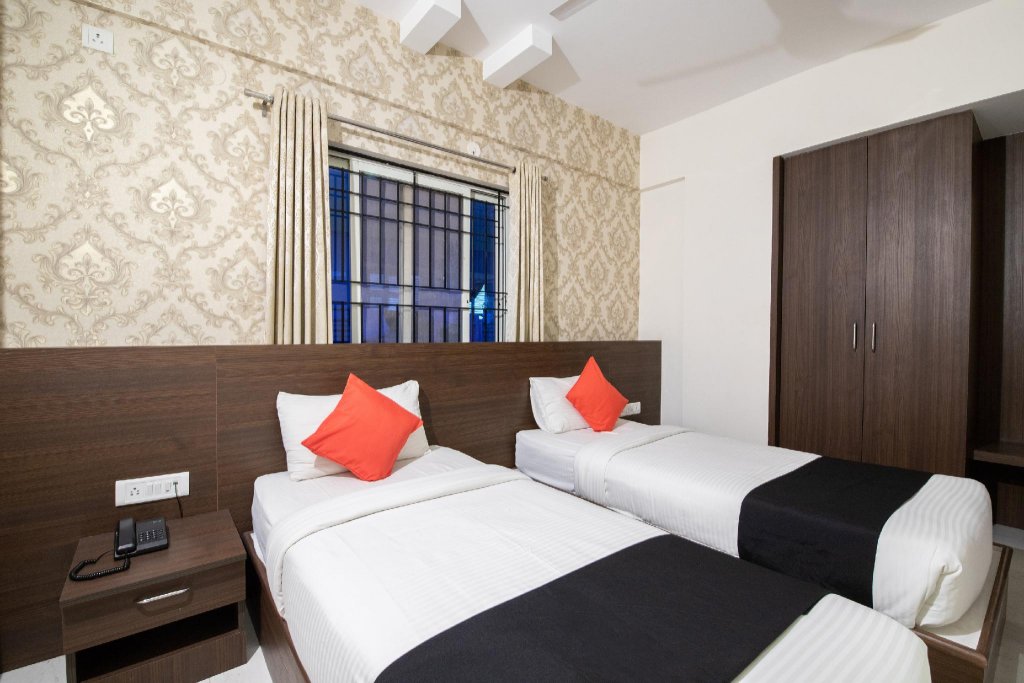 Фото Capital O 9917 Sjr Suites And Comforts