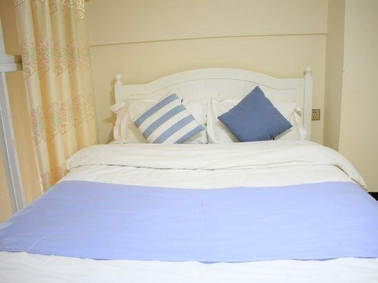 Фото Guangzhou Yi Long International Apartment