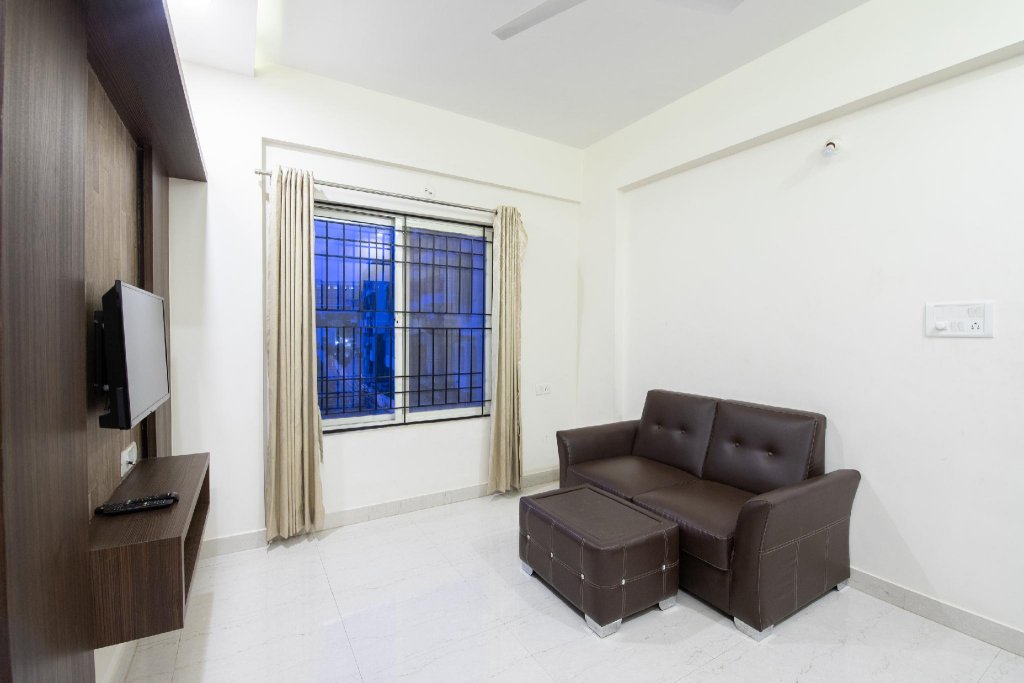 Фото Capital O 9917 Sjr Suites And Comforts