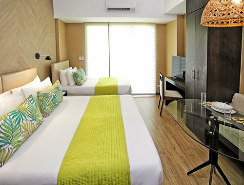 Гостиница The Serviced Residences At Kasa Luntian Managed by в Тагайтае