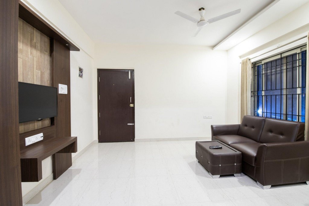 Фото Capital O 9917 Sjr Suites And Comforts
