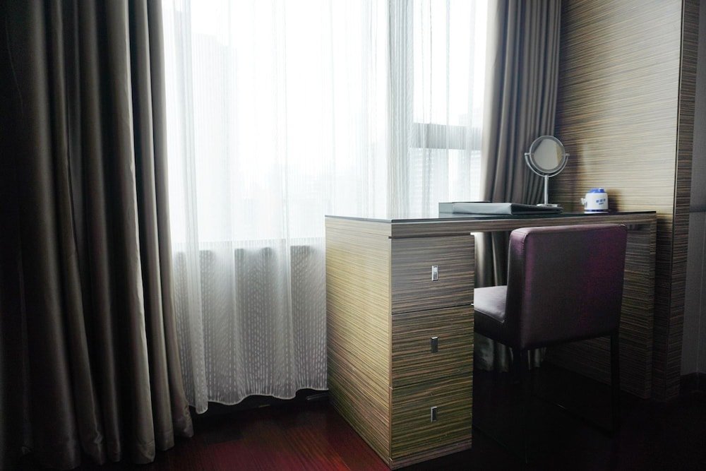 Фото La Perle International Hotel