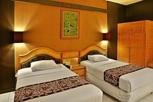 Фото Puri Naga Beachfront Cottages