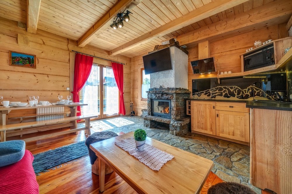 Фото Domki Ze Hej z kominkiem lub sauną