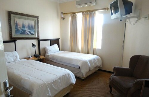 Гостиница Global Village Guesthouse в Манзини