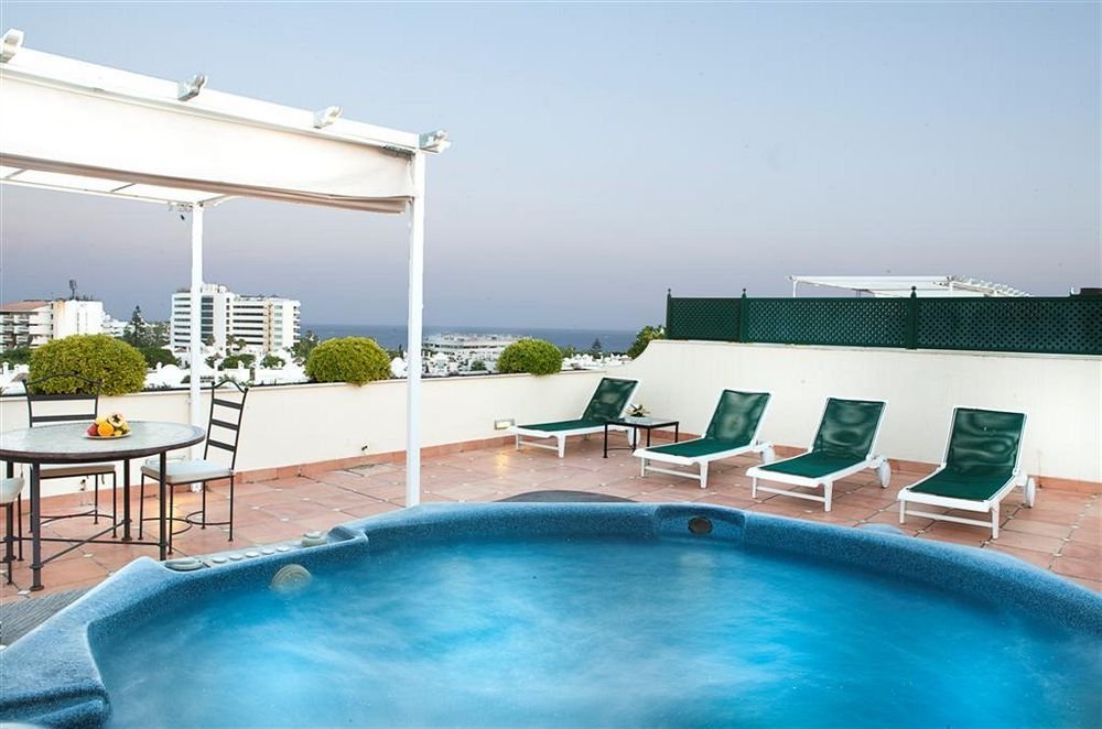 Фото Apartamentos Guadalpin Boutique