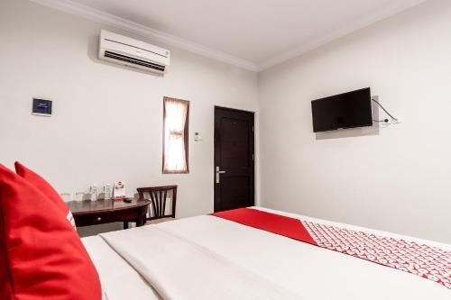 Фото Oyo 283 Helvetia Residence