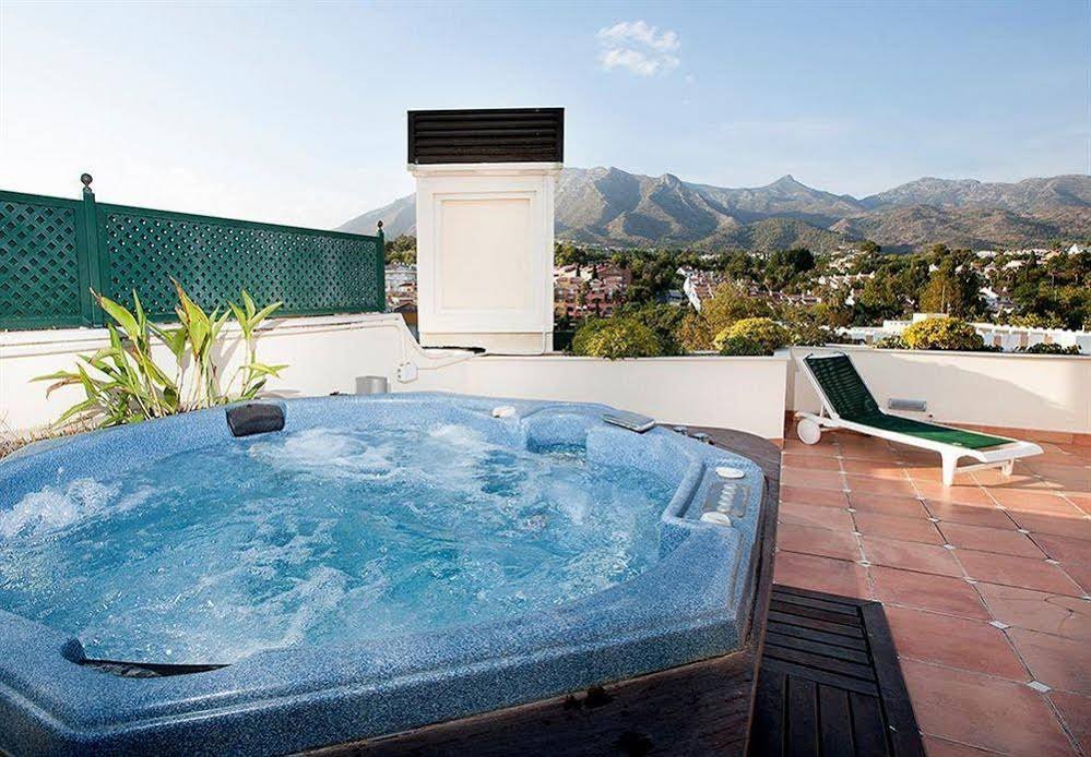 Фото Apartamentos Guadalpin Boutique