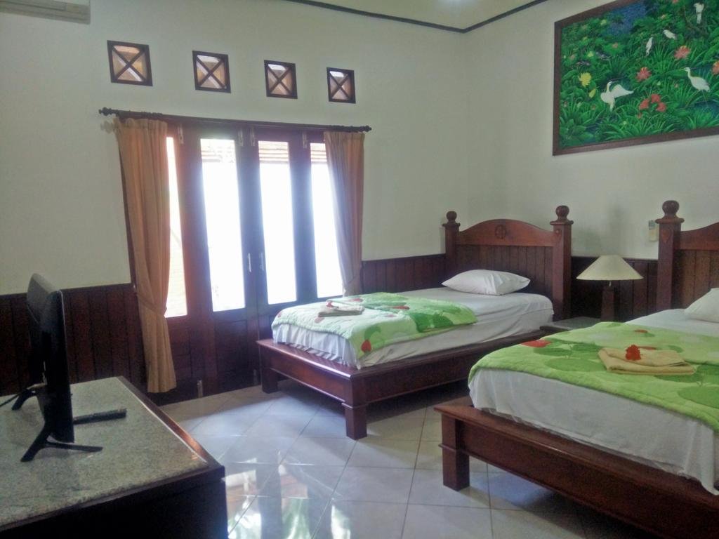 Фото Puri Rai Hotel