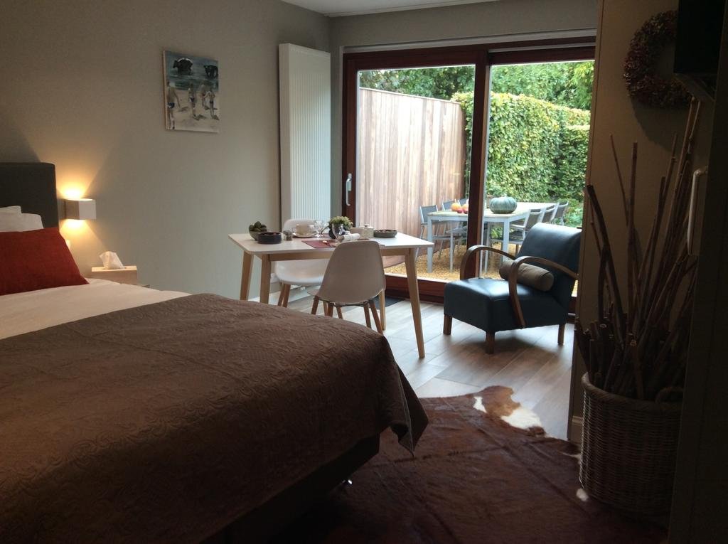 Фото B&b De Tuinkamer