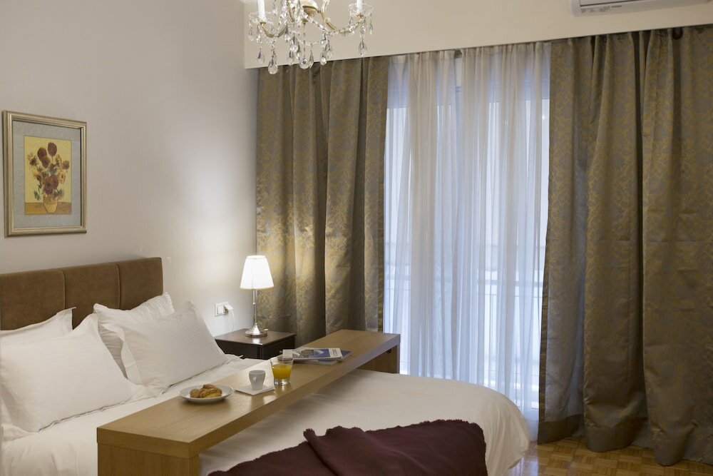 Фото Koukaki Deluxe Apt at Syggrou-Fix