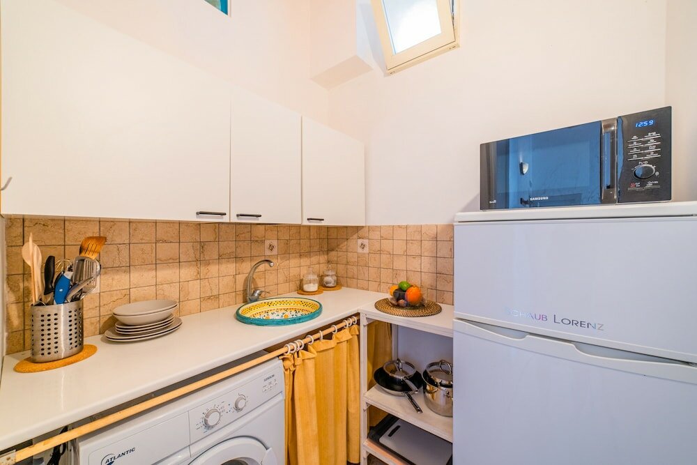 Фото Charm Of Ortigia Central Flat