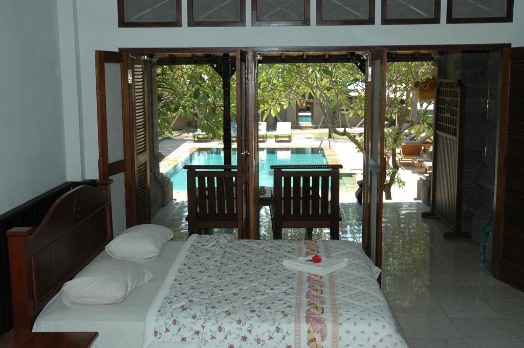 Фото Puri Rai Hotel