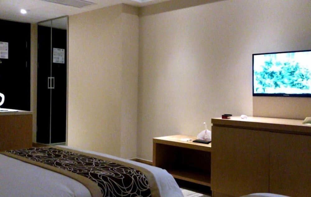 Фото New Beacon Xu Dong International Hotel