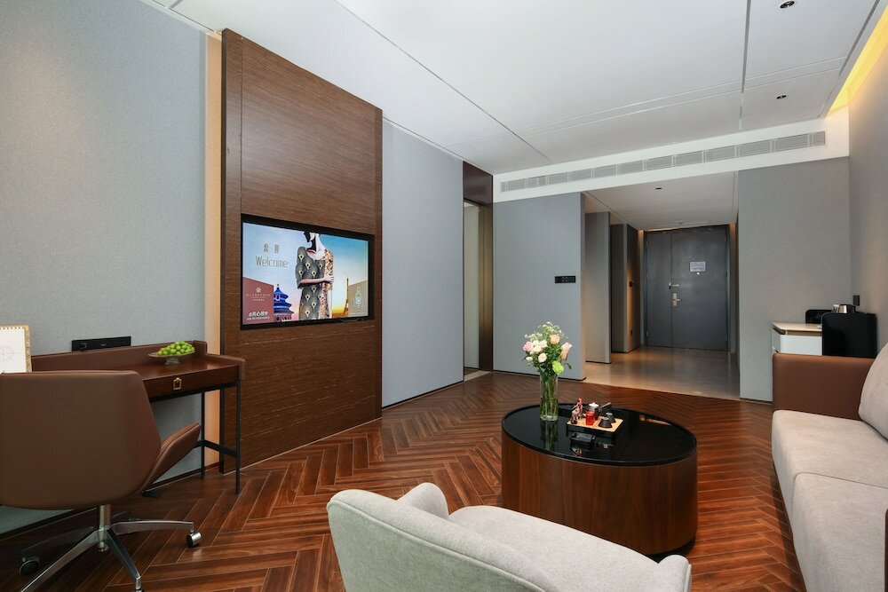 Фото Tiegang Jinjiangduchengjiudian