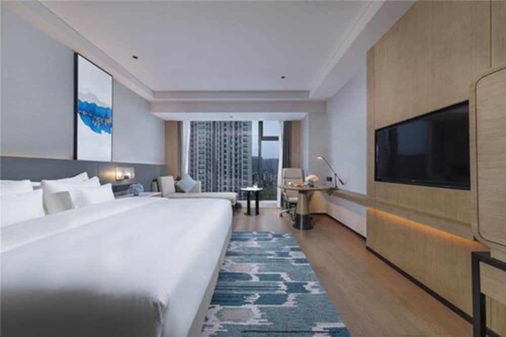 Фото New Century Hotel Zhenhai