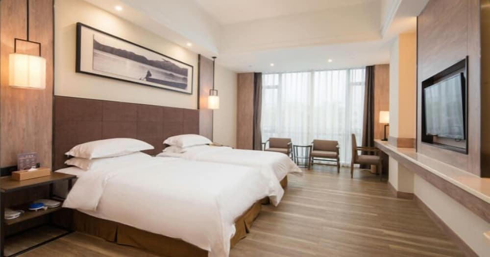 Фото Auden International Hotel