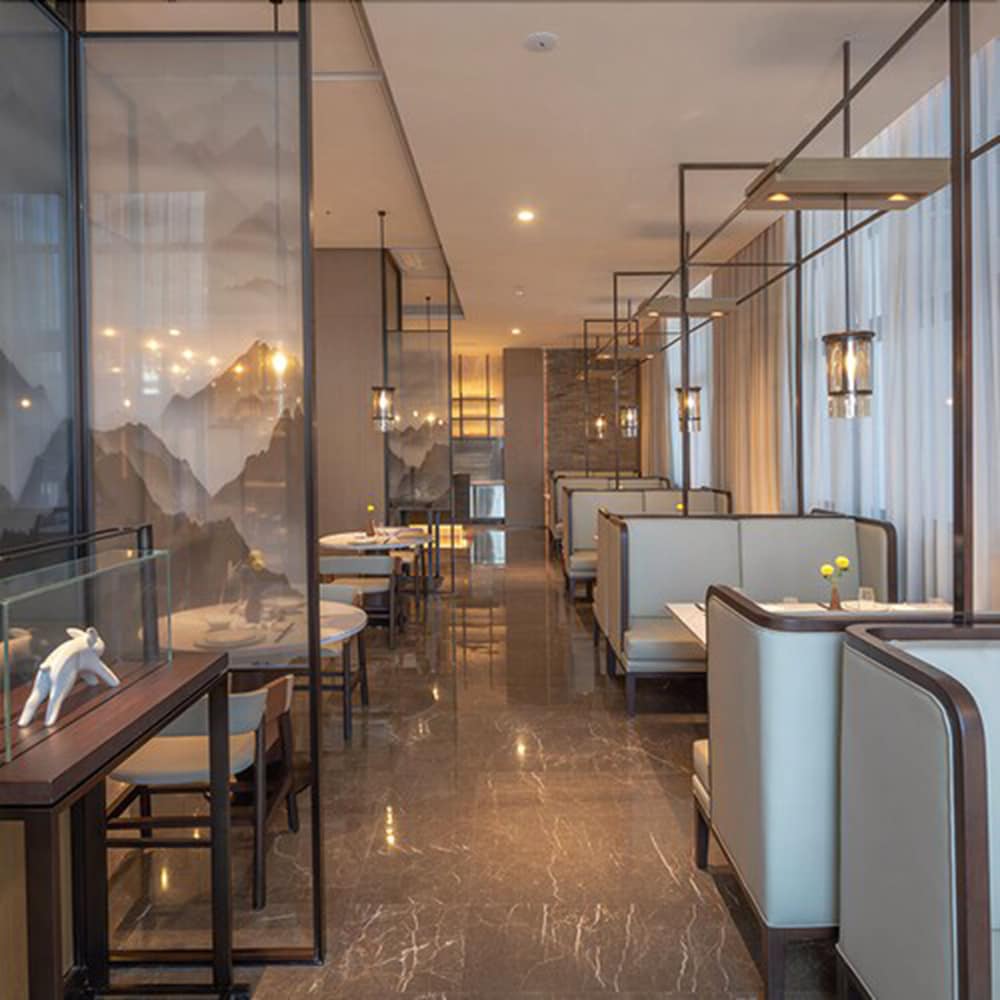 Фото New Century Hotel Zhenhai